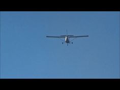 an airplane is flying in the blue sky with it's landing gear extended out