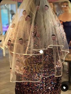 a dress made out of sequins with pictures of people on the front and back