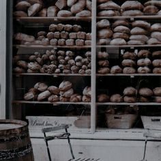 there is a bike that is parked in front of a store window with doughnuts on the shelves