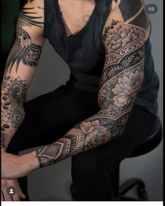 a man with many tattoos on his arm