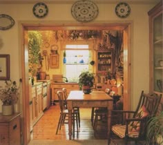 a kitchen with wooden floors and lots of furniture