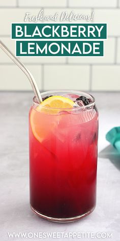 a red drink with lemon and blackberries in it