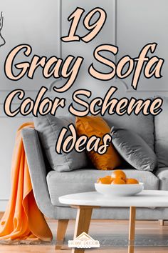 a gray sofa sitting next to a white coffee table with orange pillows on it and the words, 19 gray sofa color scheme ideas