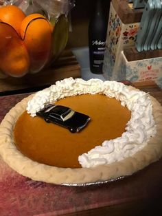 there is a pie on the table with oranges in the background