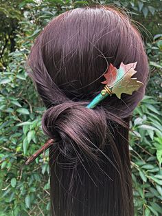 "Get ready for the Fall with this seasonal themed hair stick.  Sculpted with polymer clay around a wooden base, this beautiful ombre green, bronze and gold maple leaf hair pin measures 7.25\" long.  Hand painted with quality metallic pigment colors.  A small green rhinestone crystal gives a touch of sparkle to the hair stick  These colors really capture the season.  Add this decorative leaf hair stick to your messy bun to compliment your Autumn outfits.   You can purchase a single hair stick or Autumn Wedding Hair, Clay Autumn, Spring Hair Accessories, Cottagecore Nature, Fall Wedding Hairstyles, Butterfly Wing Earrings, Decorative Leaves, Tulle Bows, Hair Fork