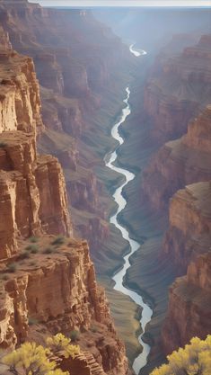 a river flowing through a canyon surrounded by mountains