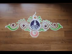 the design on the floor is made from paper and colored with white, green, blue and red colors