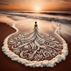 a woman is standing on the beach with her dress made out of sand and water