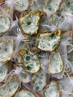 some white and gold decorated cookies in plastic wrappers