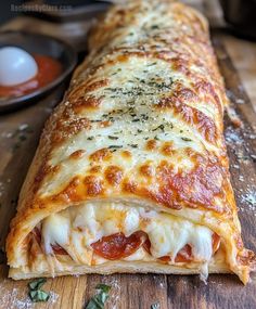 a piece of pizza sitting on top of a wooden cutting board