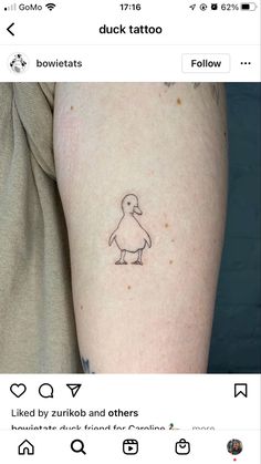 a small duck tattoo on the arm