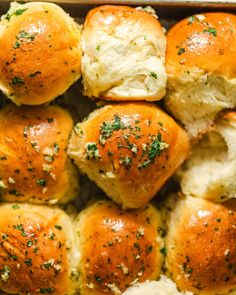 freshly baked rolls with cheese and herbs in a baking pan, ready to be eaten