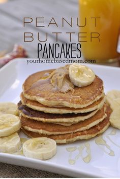 pancakes with bananas and peanut butter on a white plate