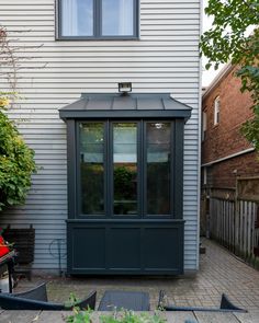 a small house with a patio in front of it