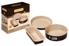 three pans and two plates in front of a box