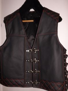 MATERIAL: GENUINE LEATHER  Two inside pockets. Biker vest. Patch vest. Perforated leather-1,8mm. Impregnated leather(dark gray). Made by designer and leather tailor with experience of 30 years. There can be produced in any size and model take 5-10 days. Order can be any size from M to 6X. The leather can be selected by color, thickness up to 2 mm. How to remove size: chest width = cm or inch? waist width = cm or inch? length back = cm or inch? If any questions, please feel free to ask! Sleeveless Fitted Leather Biker Jacket, Fitted Sleeveless Leather Biker Jacket, Gothic Black Leather Biker Jacket, Black Leather Moto Vest, Moto Style Sleeveless Vest For Biker Events, Black Fitted Moto Vest, Black Sleeveless Moto Outerwear, Leather Biker Vest Sleeveless, Leather Sleeveless Vest For Motorcycling