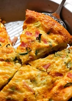 a pan filled with cheesy bread on top of a table