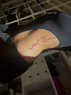 a person with a tattoo on their back