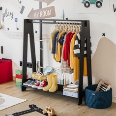 a child's room with clothes and toys