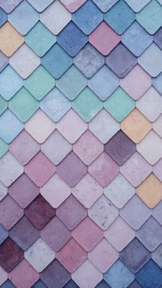 an image of colorful tiles on the side of a building that looks like it is made out of different colors