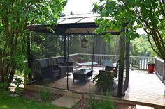 a gazebo sitting on top of a wooden deck