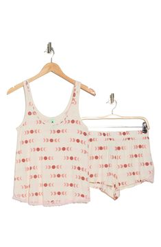 Stay chic and cozy in these palm patterned pajamas that pair a breezy tank and shortie shorts. Top: 24.25" length (size Small); pants: 14.5" leg opening; 11.5" front rise; 14.5" back rise (size Small)
 Top has scoop neck, tank straps Bottoms have elastic banded waist 95% rayon, 5% spandex Machine wash cold, lay flat to dry Imported Model stats: 5'10", 32" bust, 25" waist, 36" hip. Model is wearing size Small. Comfortable Pajama Shorts For Beach Season Loungewear, Comfortable Pajama Shorts For Beach Season, Comfortable White Sleepwear For Vacation, Cotton Tank Top For Pajama Party In Summer, Cotton Tank Top For Summer Pajama Party, Summer Sleepwear For Pajama Party In Short Style, Sleeveless Printed Tops For Loungewear, White Summer Tank Top For Loungewear, White Printed Sleepwear For Vacation