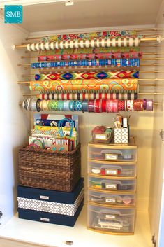 an organized craft closet filled with lots of different types of tapes and other things to sew