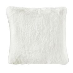 a white pillow with fluffy fur on the front and back side, it's made from