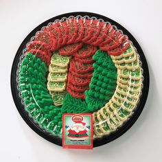 a plate that has some type of food on it with green, red and yellow decorations