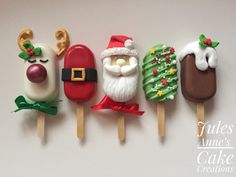 four pops decorated to look like santa claus and other holiday treats are lined up on top of each other