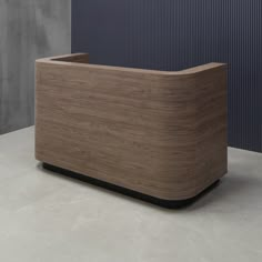 a wooden box sitting on top of a white counter next to a blue and gray wall