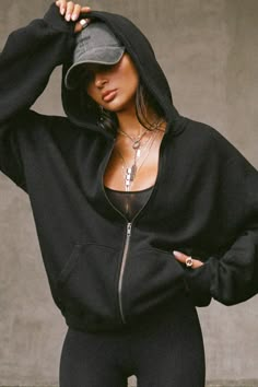 Front view of model posing in the oversized comfortable black french terry Oversized Zip Hoodie with a full length front zip closure, side pockets and thumbholes in the fitted cuffs Aesthetic Zip Up Hoodie, Baggy Hoodie Outfit, Dance Workout Clothes, Hoodie Outfit Aesthetic, Nanny Outfits, Swim Clothes, Gym Girlies, Black Dress Mini, Hoodie Model