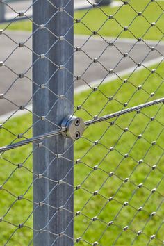 a close up of a metal fence post