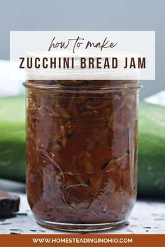 a jar filled with zucchini bread jam sitting on top of a table