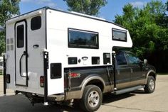 a truck with a camper attached to the back