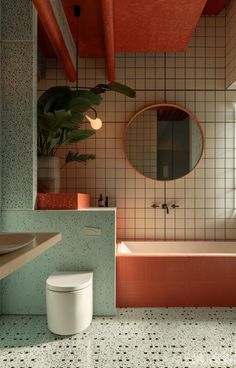 a bathroom with a toilet, sink and bathtub next to a mirror on the wall