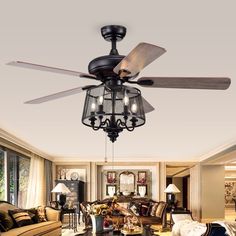 a living room with couches, chairs and a ceiling fan that is hanging from the ceiling