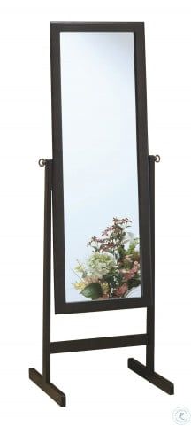 a large mirror sitting on top of a wooden stand next to a flower vase in front of it