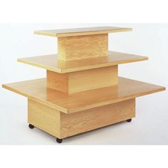 three wooden boxes stacked on top of each other with the tops turned down to show their sides