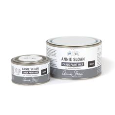 an open can of annie sloan chalk paint next to a tin of brown and white wax