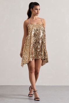 Perfect for dancing in the desert, our Nevada mini dress arrives coated in gold sequins that will glisten in the sunlight. This gold mini showcases a low back and draped hanky hem creating movement. Get festival ready and style yours with your favourite gold accents and boots. Features - Premium sequin- Halter neckline - Sleeveless- Low back- Invisible zip closure - Hanky hem- Mini length Sizing & Fit Model is 5'7" and wears UK size 8 / US size 4Product Information Designed exclusively by Club L London Fully lined with some stretch Premium sequin in Gold (100% Polyester) 85cm total length SKU: CL133269007 Fishtail Maxi Dress, Sequin Halter, Black Dress Prom, Hanky Hem, Black Tie Gala, Sequin Maxi, Christmas Party Dress, Black Velvet Dress, Skirt Co Ord