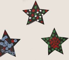 three paper stars with dots on them