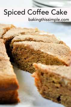 sliced coffee cake sitting on top of a white plate