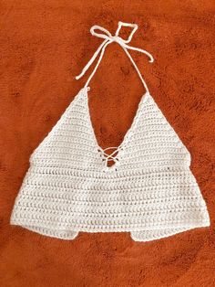 This product was hand crocheted made entirely from recycled materials.  Easily adjusts to fit multiple sizes.  An eco-friendly cute summer tank that can go with any outfit! White Camisole Crop Top For Beach, Summer Crochet Lace Top Made Of Yarn, White Crochet Halter Top For Summer, Cotton Crochet Top With Crochet Trim For Beach Season, Spring Vacation Crochet Tank Top, Knit Crochet Top For Summer, Cotton Crochet Top With Trim For Beach Season, White Crochet Cotton Halter Top, Summer Knit Crochet Crop Top