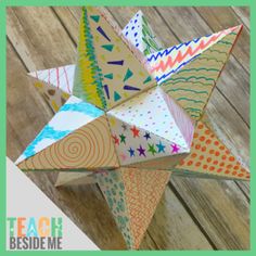 an origami star sitting on top of a wooden table