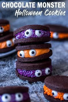 chocolate monster halloween cookies with googly eyes and orange frosting on top are stacked in the shape of hamburgers