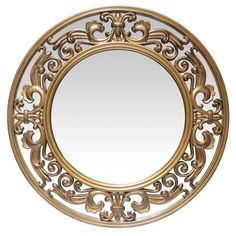 a round mirror with an ornate design on it