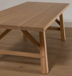 a wooden table sitting on top of a hard wood floor