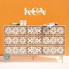 the sideboard is decorated with geometric designs