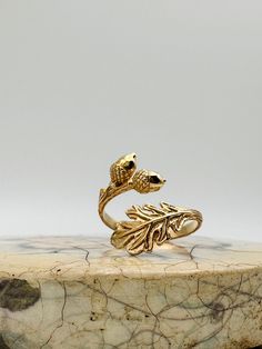 Gold Acorn with Oak Leaves Adjustable Ring - Acorn Ring, Fall Rings, Oak Leaf, Adjustable Ring, Symbolic Jewelry, Oak Branch Ring. ✦The ring is gold bronze and adjustable. **PLEASE NOTE: THIS LISTING IS ONLY FOR ONE RING.**  Sterling silver available below https://www.etsy.com/listing/1606720975/sterling-silver-acorn-with-oak-leaves?click_key=a838a137135e29172b9589dd7aea42a06908e6ea%3A1606720975&click_sum=e434e2a0&ref=shop_home_active_13&pro=1&sts=1 🎁Comes ready to gift in a gift box or bag. ❤️ Acorn Ring, Oak Leaf Jewelry, Oak Jewelry, Oak Branch, Acorn And Oak, Fall Rings, Branch Ring, Book Jewelry, Symbolic Jewelry